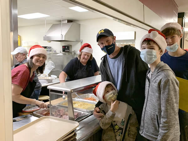Verberg family gives back by volunteering at Supper House and NECM
